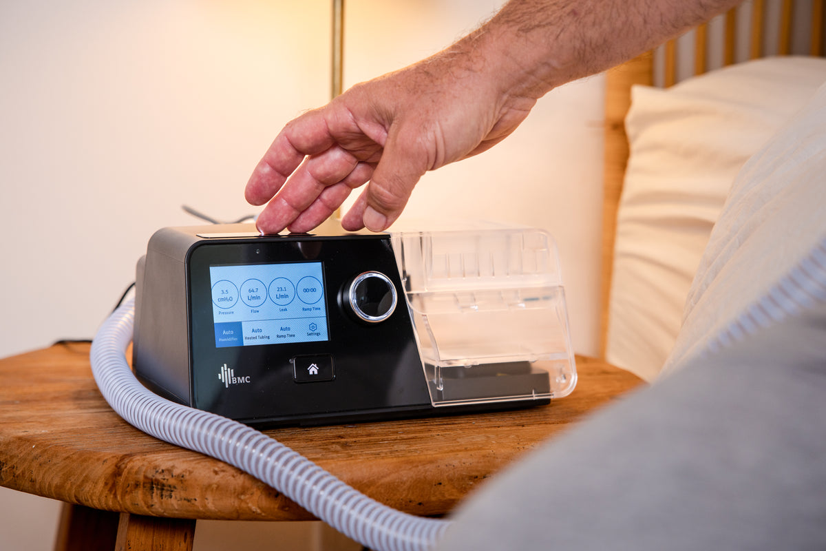 Person using BMC G3 X AutoPAP CPAP Machine